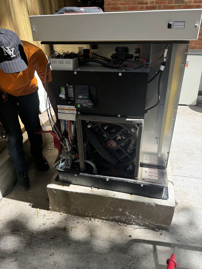 Technician repairing enclosure generator